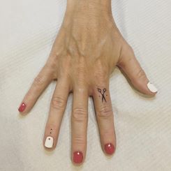 Tiny Scissor Finger Tattoo